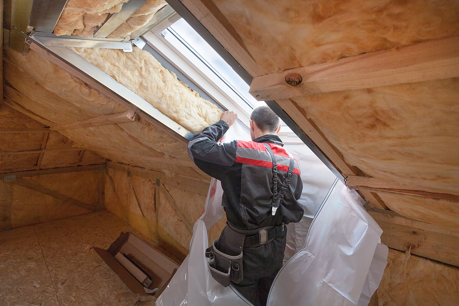 man installing skylight